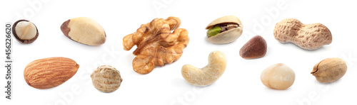Set with different tasty nuts on white background. Banner design