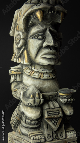 mayan figure from the front on black background