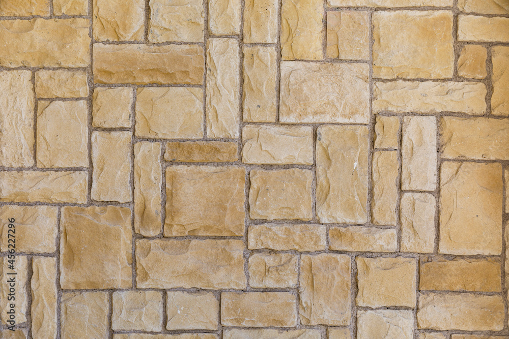 Fototapeta premium Wall covered with decorative stones