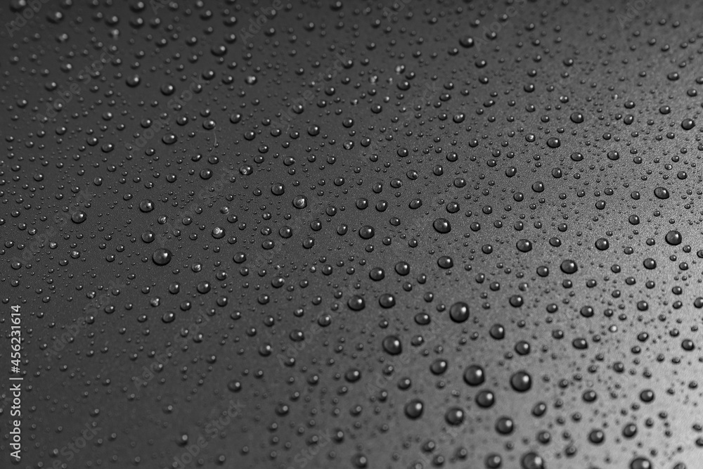 drops of water on a black background. texture. dew on the surface. moistening. drops after rain or fog. drops of water on a black background. texture. dew on the surface. moistening. drops after rain or fog.