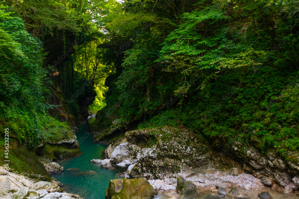 MARTVILI, GEORGIA: Abasha River with azure water in Martvili Canyon on a summer day. MARTVILI, GEORGIA: Abasha River with azure water in Martvili Canyon on a summer day.