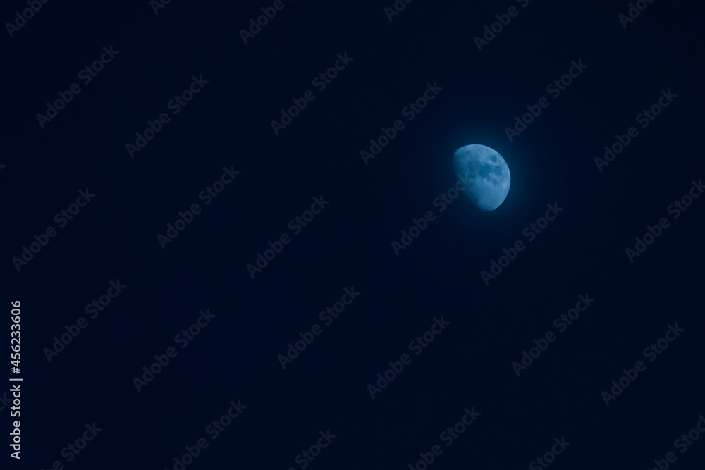 the half moon with dark sky at night time