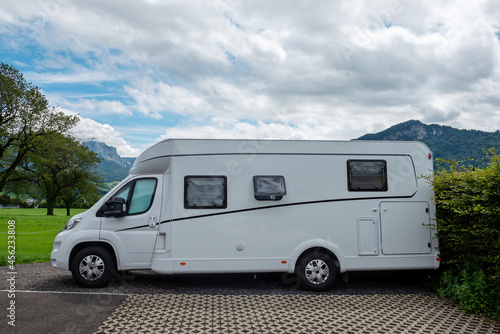 Caravan car vacation. Family vacation travel RV. Holiday trip in motorhome. Switzerland natural landscape