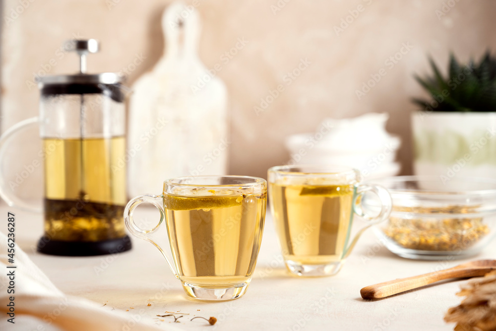 Herbal tea glass cups and teapot. Delicious healthy warm tea. Herbal tea glass cups and teapot. Delicious healthy warm tea.