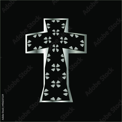 cross with patterns of metal on a black background. 