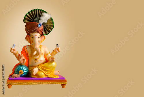 Hindu God Ganesha on colorful background, with copy space, Ganesha is the patron of arts and sciences photo