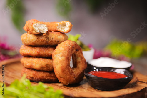 Murais de parede Chicken Doughnuts with tomato sauce close up with selective focus and blur