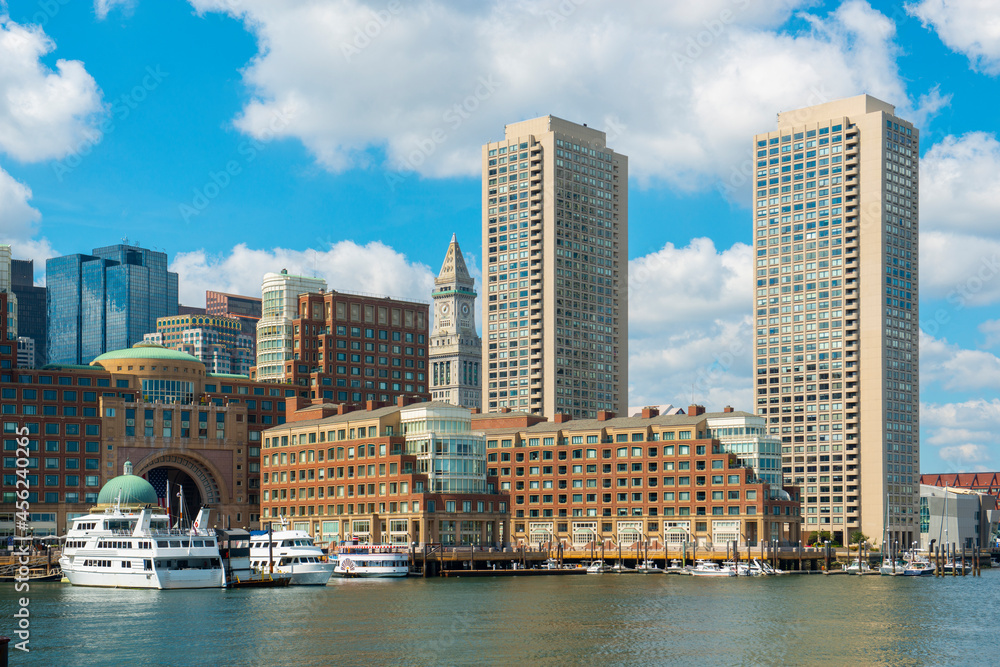 Fototapeta premium Boston Harbor view including Custom House, Rowes Wharf and modern Financial District skyline from Seaport District, city of Boston, Massachusetts MA, USA. 