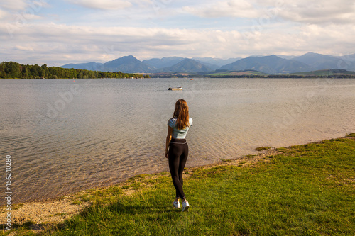 Woman standing by the lake Liptovska Mara
 photo