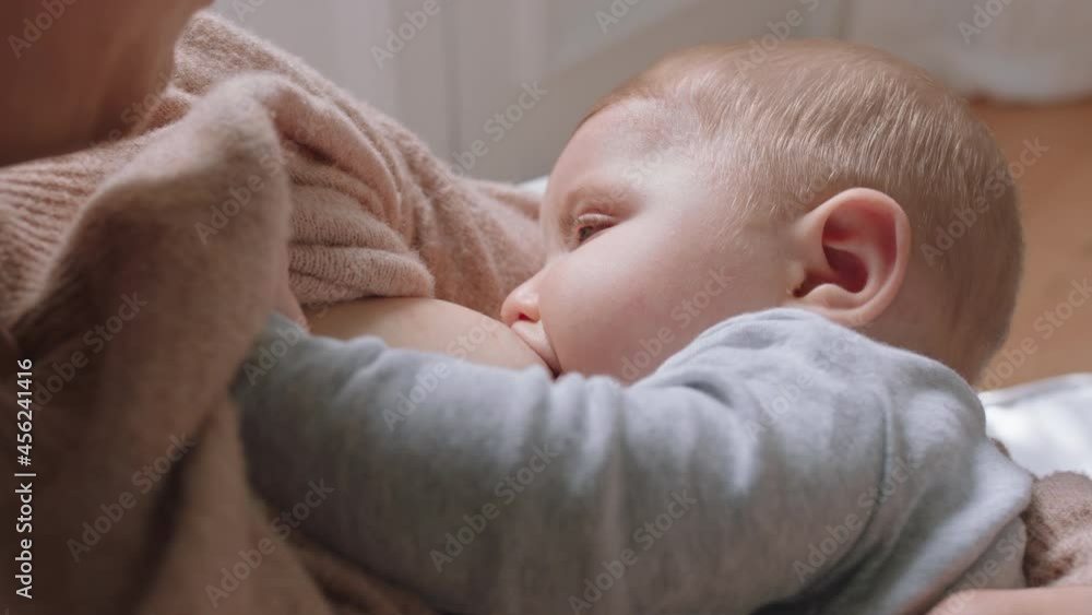 mother breastfeeding baby at home mom nursing infant nurturing child suckling milk from breast motherhood maternity care mother breastfeeding baby at home mom nursing infant nurturing child suckling milk from breast motherhood maternity care