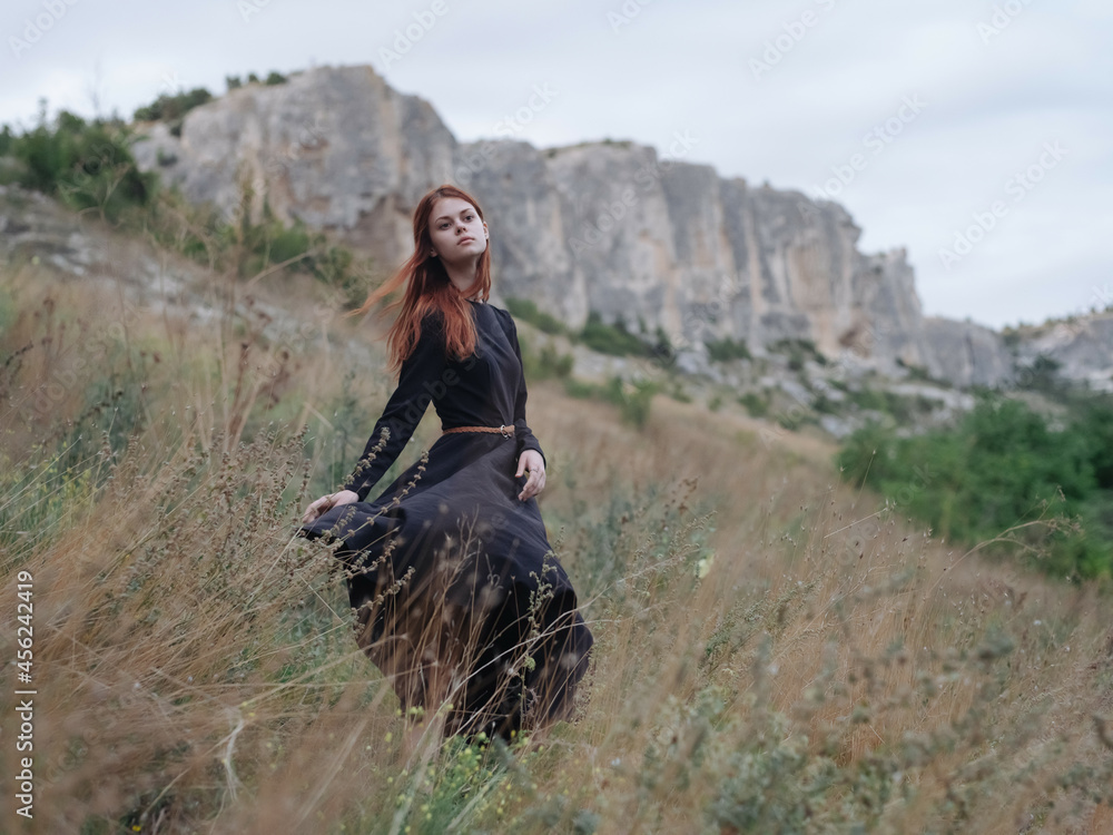 woman in black dress outdoors mountains walk Freedom lifestyle