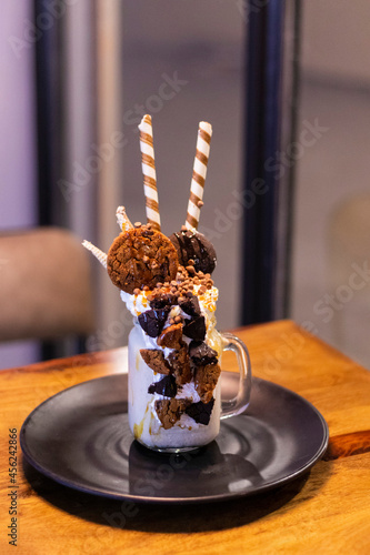 Chocolate cream freak shake in black plate 
