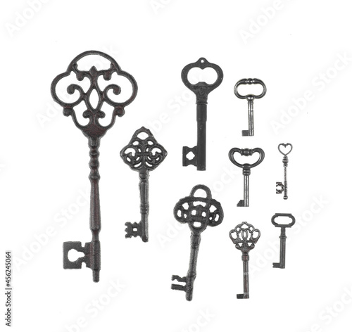 collection of ancient rusty keys isolated on white background