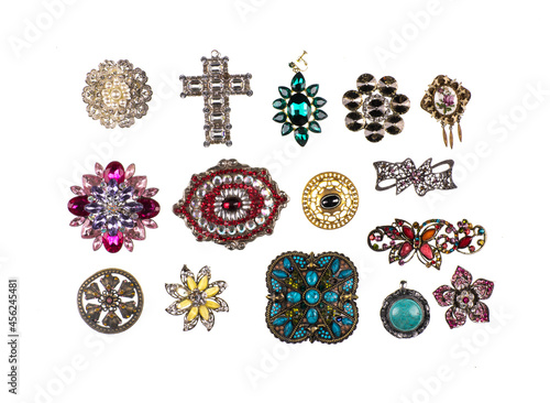 Canvas collection of jewelry brooches isolated on white background