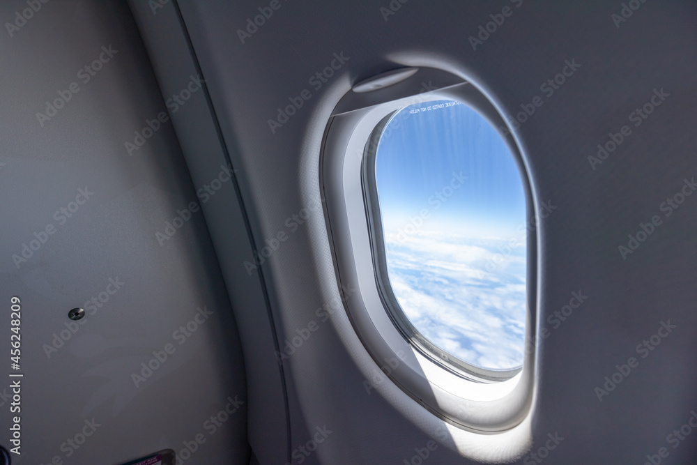 Airplane window cloud and blue sky Airplane window cloud and blue sky