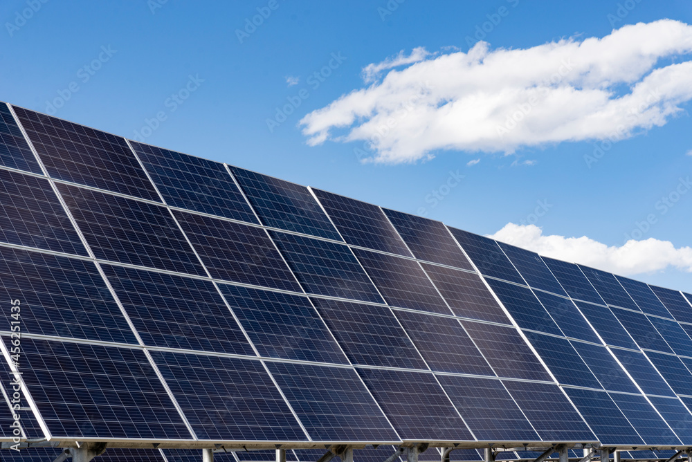 Solar panels installed on roof with clear sunshine.