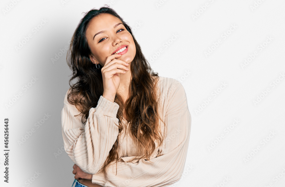 Young hispanic girl wearing casual clothes smiling looking confident at the camera with crossed arms and hand on chin. thinking positive. Young hispanic girl wearing casual clothes smiling looking confident at the camera with crossed arms and hand on chin. thinking positive.