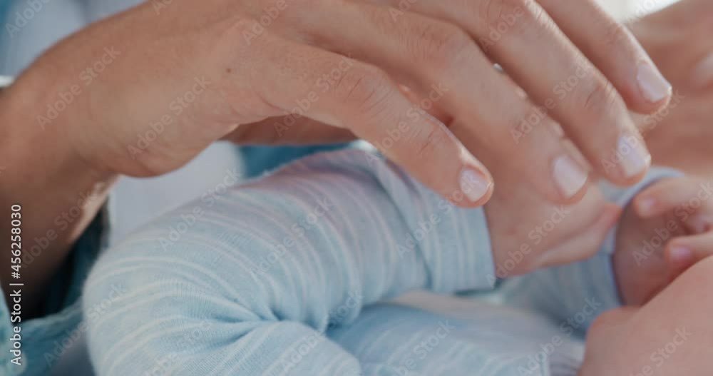 close up mother holding baby hand touching fingers mom nurturing newborn caring for infant at home motherhood love 4k close up mother holding baby hand touching fingers mom nurturing newborn caring for infant at home motherhood love 4k