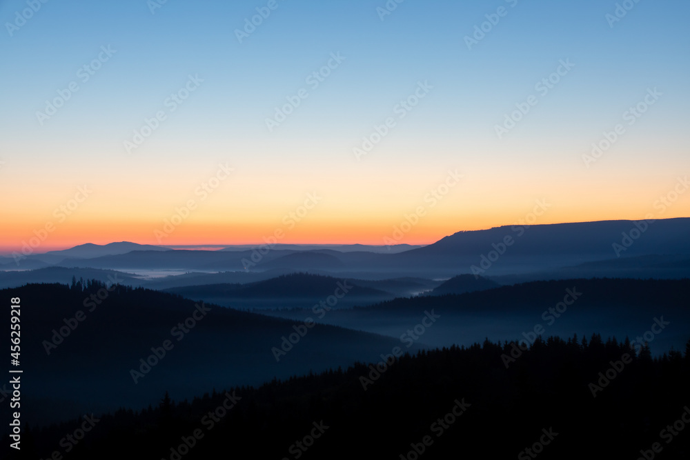 a beautiful landscape with the Carpathian mountains seen from above in the morning