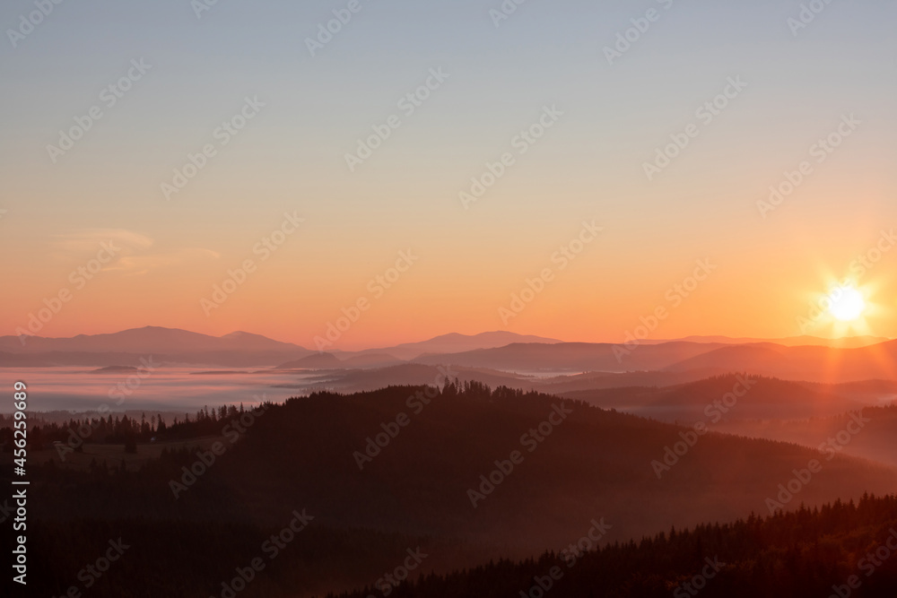 landscape with sunrise over the mountains