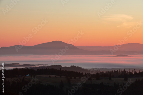 landscape over mountains and fog in the valleys in the morning