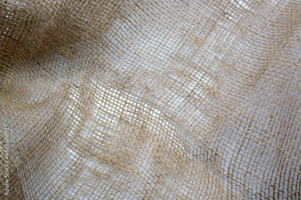 Burlap crumpled texture background brown, woven, close-up Burlap crumpled texture background brown, woven, close-up