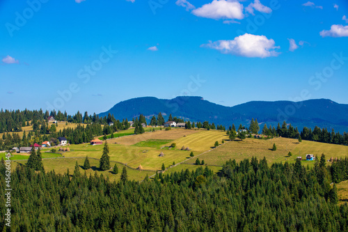 landscape with scattered houses on the mountain © sebi_2569