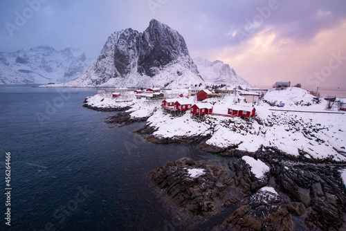 Mountain rural fishing village by the sea ocean winter snow houses