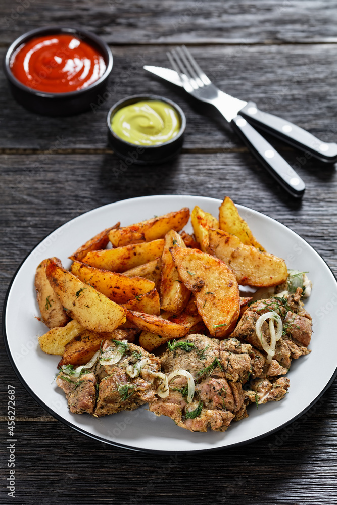Grilled Pork Shoulder Steaks with potato wedges Grilled Pork Shoulder Steaks with potato wedges