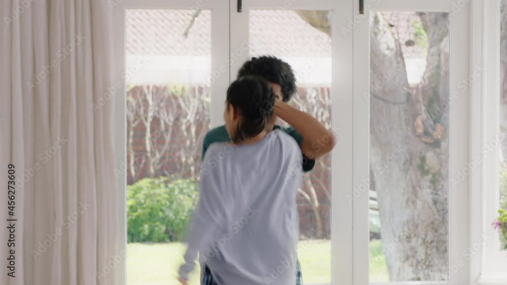 happy father dancing with teenage daughter having fun enjoying playful dance enjoying weekend celebration at home wearing pajamas happy father dancing with teenage daughter having fun enjoying playful dance enjoying weekend celebration at home wearing pajamas