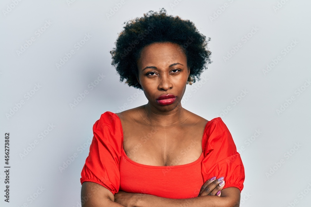 Young african american woman wearing casual clothes skeptic and nervous, disapproving expression on face with crossed arms. negative person. Young african american woman wearing casual clothes skeptic and nervous, disapproving expression on face with crossed arms. negative person.