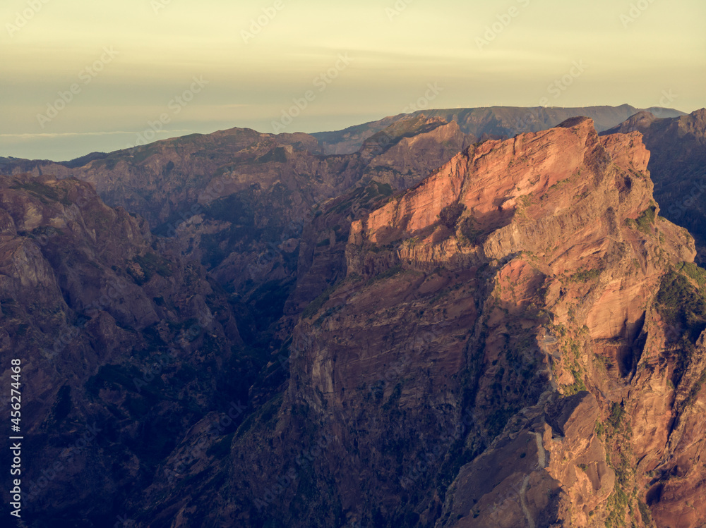 Fototapeta premium Aerial view of picturesque volcanic mountains at sunrise.