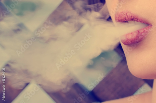 Smoke from an electronic cigarette, close-up. Tinted photograph.