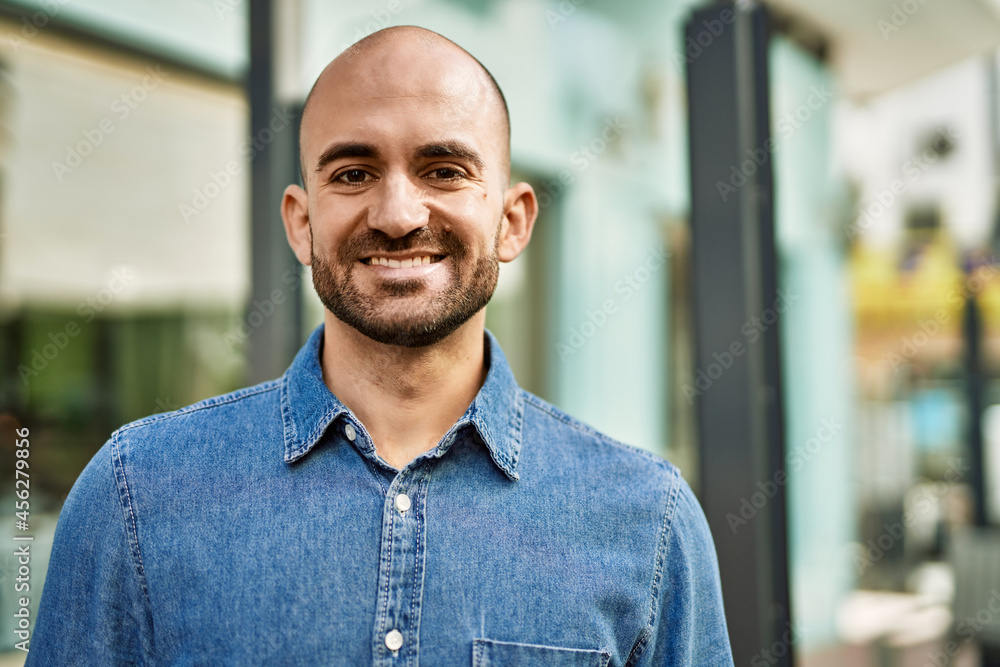 Young hispanic man smiling happy standing at the city. Young hispanic man smiling happy standing at the city.