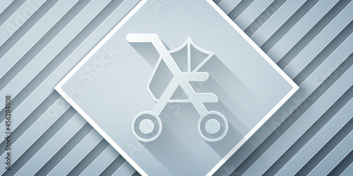 Paper cut Baby stroller icon isolated on grey background. Baby carriage, buggy, pram, stroller, wheel. Paper art style. Vector