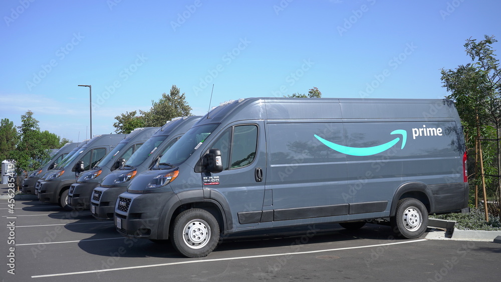 Parked rows of Amazon Prime delivery vans. Photo taken in Carlsbad, CA USA  on September 10, 2021. Stock Photo | Adobe Stock