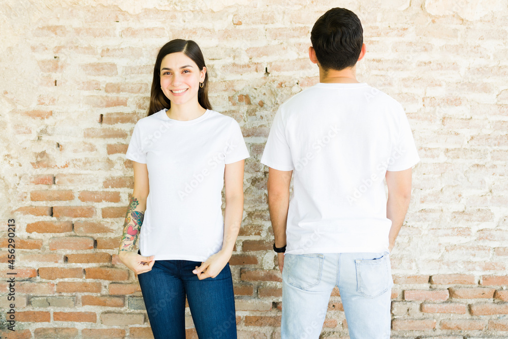 Latin woman and man wearing trendy t-shirts