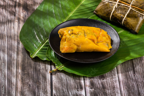 Colombian Tamale recipe with steamed banana leaves photo