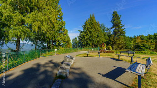 Fototapeta Naklejka Na Ścianę i Meble -  View benches at Burnaby Mountain Park gardens after a long, dry summer with record high temperatures and drought-like conditions