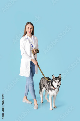 Veterinarian with cute dog ...