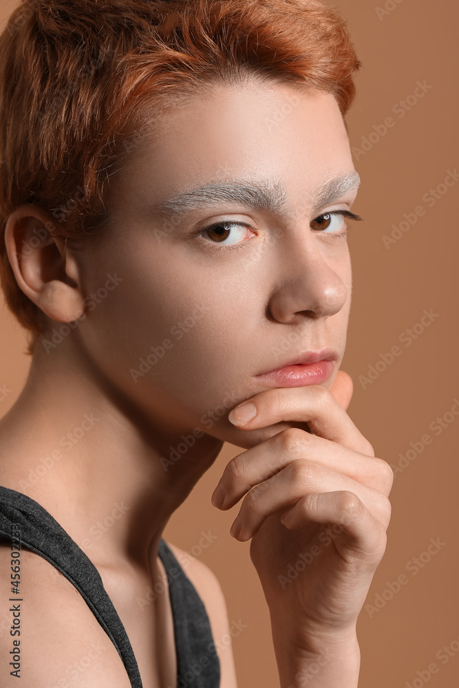 Teenage boy with dyed eyebrows on color background, closeup Teenage boy with dyed eyebrows on color background, closeup