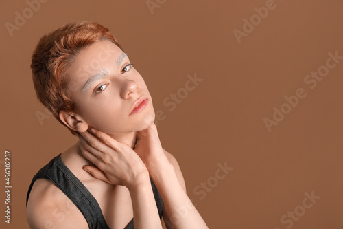 Teenage boy with dyed eyebr...