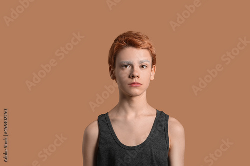 Teenage boy with dyed eyebr...