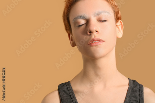 Teenage boy with dyed eyebr...