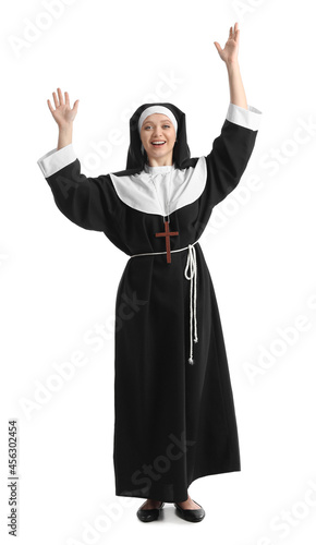 Happy young nun on white background