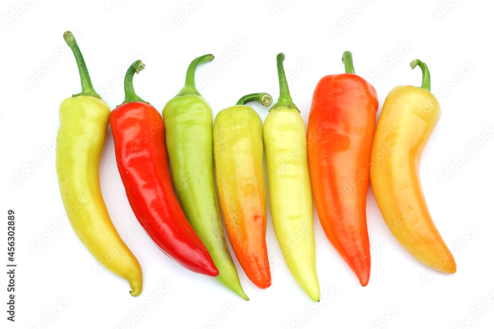 close up on fresh colorful peppers isolated on white background close up on fresh colorful peppers isolated on white background
