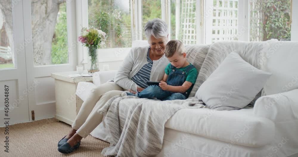 happy little boy using smartphone showing grandmother how to use mobile phone teaching granny modern technology intelligent child helping grandma at home 4k happy little boy using smartphone showing grandmother how to use mobile phone teaching granny modern technology intelligent child helping grandma at home 4k