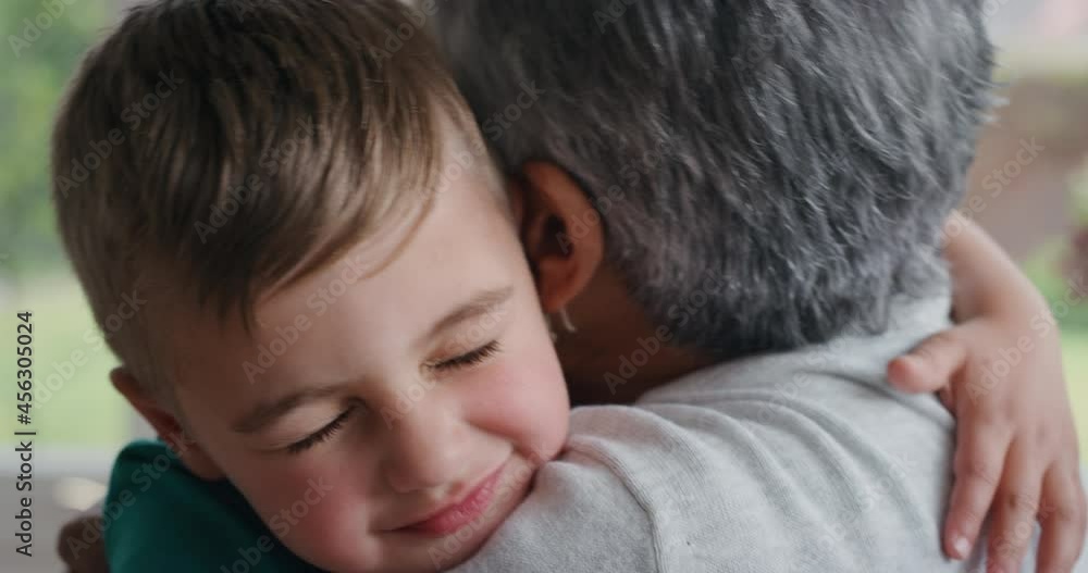 cute little boy hugging grandmother smiling embracing her grandson happy granny enjoying hug from her grandchild at home family concept 4k cute little boy hugging grandmother smiling embracing her grandson happy granny enjoying hug from her grandchild at home family concept 4k