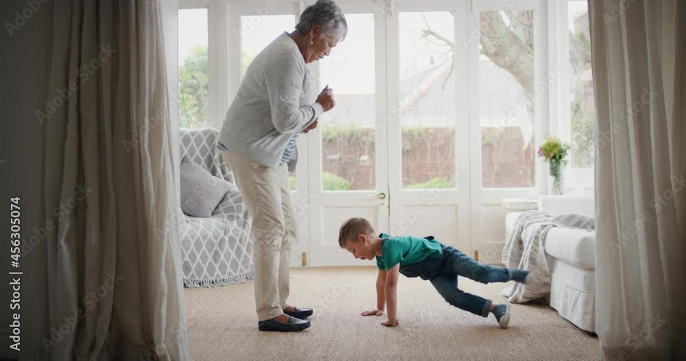 happy little boy dancing with grandmother funny granny having fun dance with grandson celebrating family weekend at home happy little boy dancing with grandmother funny granny having fun dance with grandson celebrating family weekend at home