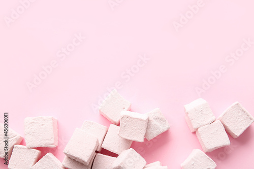 Tasty sweet marshmallows on color background